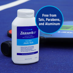 Envase Zeasorb 2.5 oz junto a objetos para comparar tamaño práctico